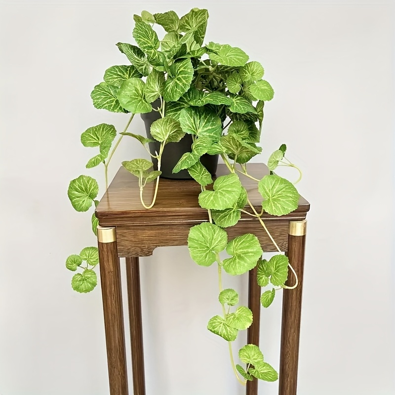 An artificial hanging vine pla - Pilea Peperomioides avaliação e preço